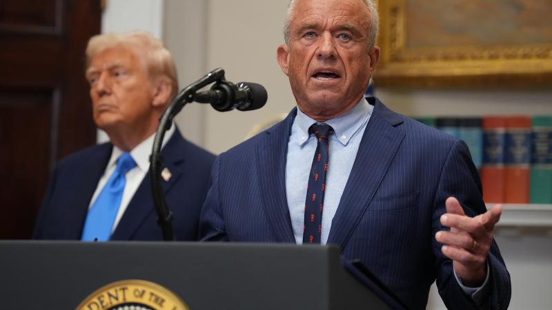 U.S. Health and Human Services Secretary Robert F. Kennedy Jr., joined by President Donald Trump (L), delivers an announcement on “significant medical and scientific findings for America’s children” in the Roosevelt Room of the White House on September 22, 2025 in Washington, DC. Federal health officials suggested a link between the use of acetaminophen during pregnancy as a risk of autism