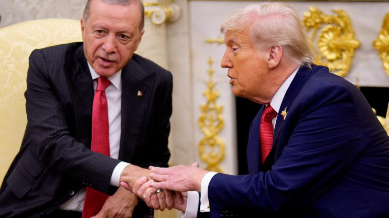 U.S. President Donald Trump (R) shakes hands with President of Turkey Recep Tayyip Erdogan in the Oval Office at the White House on September 25, 2025 in Washington, DC.