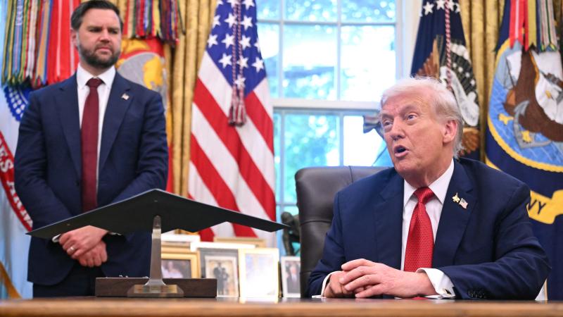 President Donald Trump speaks to the press after signing an executive order on Tiktok in the Oval Office of the White House in Washington, DC, on September 25, 2025 as Vice President JD Vance looks on