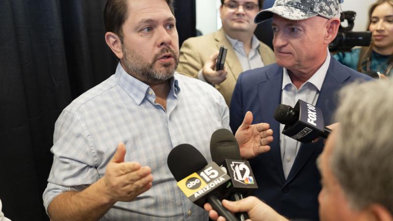 U.S. Sen. Ruben Gallego (D-AZ) and U.S. Sen. Mark Kelly (D-AZ) take questions from press after a town hall at NOAH Cholla Health Center on March 17, 2025 in Scottsdale, Arizona