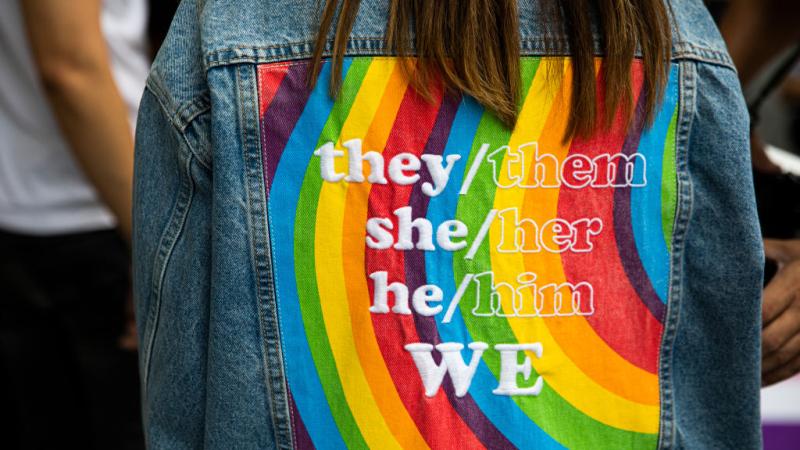 A jacket with gender pronouns