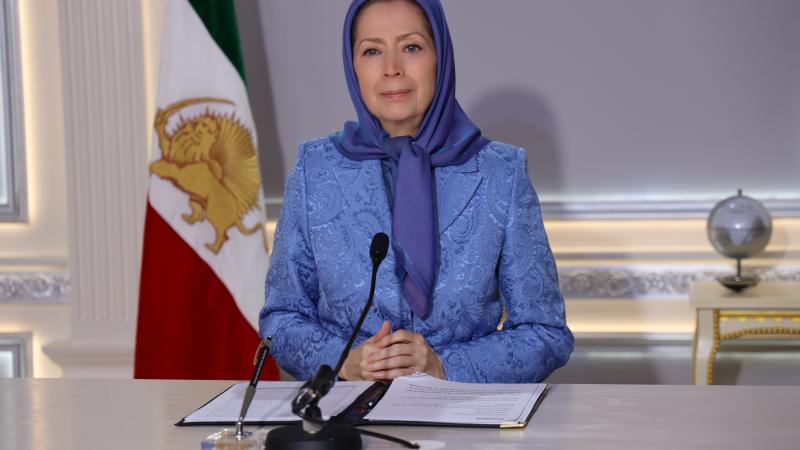 Maryam Rajavi blue suit sitting