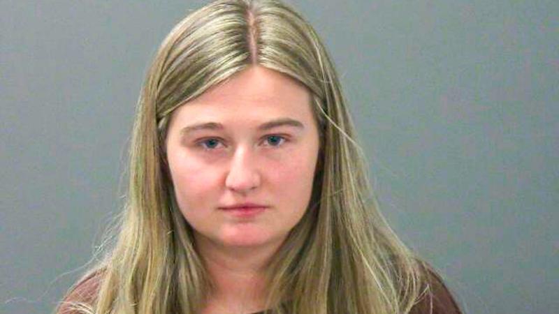 Kendra Duggar, 27, of the reality television show ‘19 Kids and Counting’, poses for a police booking photo after being charged alongside her husband Joseph for child endangerment claims on March 20, 2026 in Fayetteville, Arkansas.