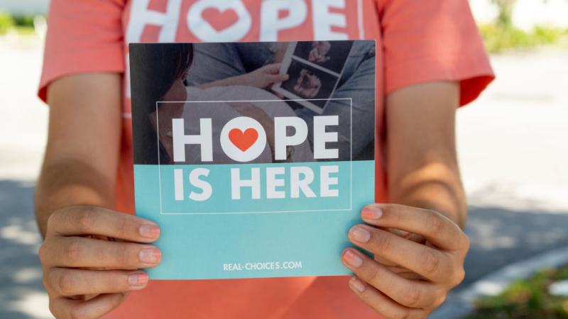 Pro-life sidewalk counseling outside abortion clinic
