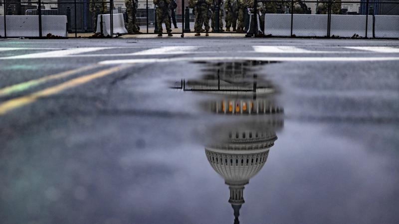 National Guard troops continue to guard the grounds of the US Capitol building in the extended security perimeter around Capitol Hill following the January 6th attack by a pro-Trump mob on February 11, 2021 in Washington, DC. 