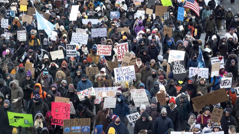 Demonstrators march through downtown protesting ICE operations and the death of Renee Good and Alex Pretti on January 25, 2026 in Minneapolis, Minnesota. 