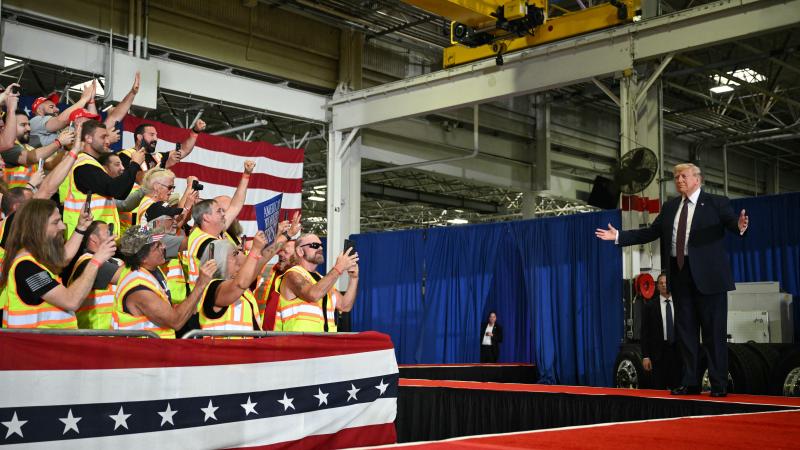 US President Donald Trump gestures as he arrives to speak during a visit to the Mack Trucks manufacturing facility in Macungie, Pennsylvania, on June 23, 2026.