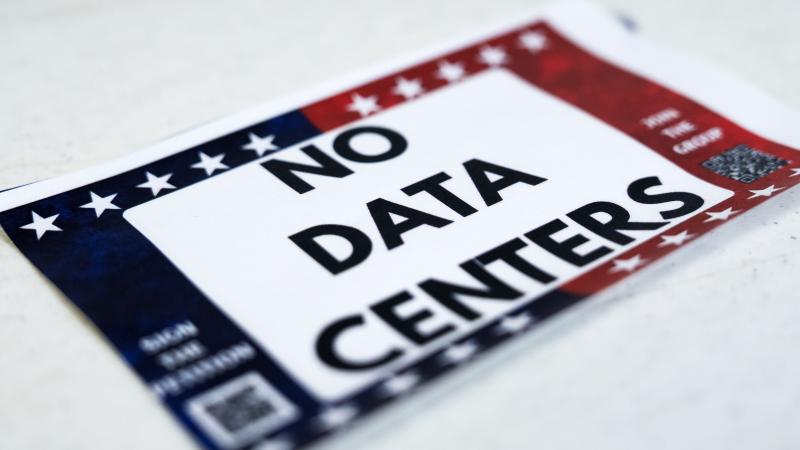 BAY CITY, TEAS - JUNE 11: A sticker against data centers is seen during a forum hosted by Matagorda County Against Data Centers on the impact of data center construction in the state, Thursday, June 11, 2026. 
