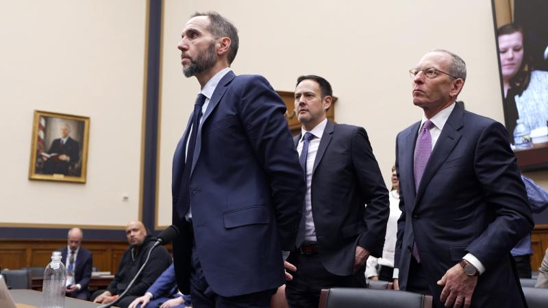 Former Special Counsel Jack Smith (L) leaves at the conclusion of his testimony at a hearing before the House Judiciary Committee in the Rayburn House Office Building on Capitol Hill on January 22, 2026 in Washington, DC. Smith testified on his team's federal criminal investigations into President Donald Trump which included 2020 election interference and classified documents. 