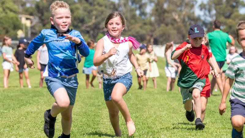 Children running in field