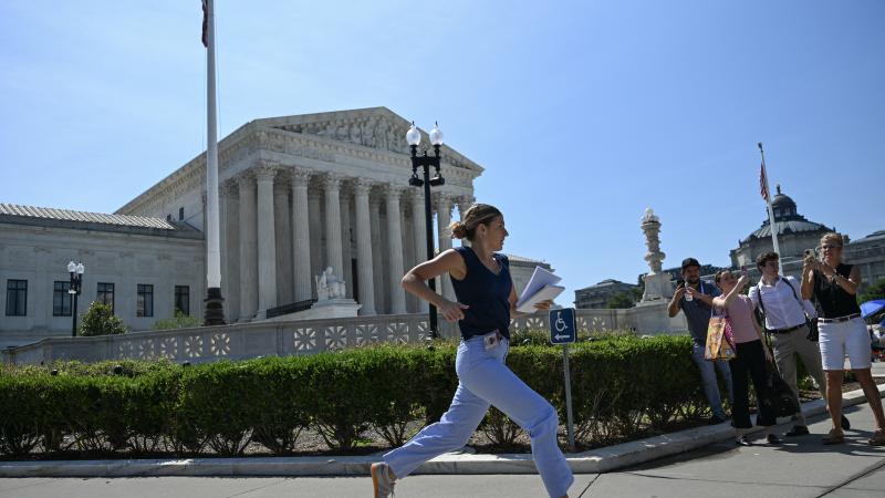 Reporter runs as court strikes down Trump's bid to end birthright citizenship