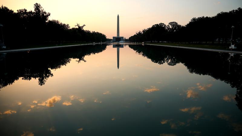  The sun begins to rise over the Lincoln Memorial Reflecting Pool on July 02, 2026 in Washington, DC.