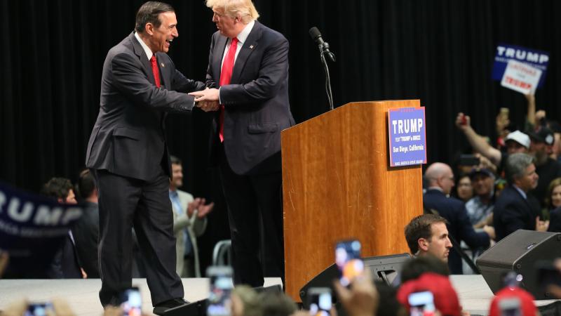 Rep Darrell Issa shakes Trumps hand at a rally in San Diego in 2016