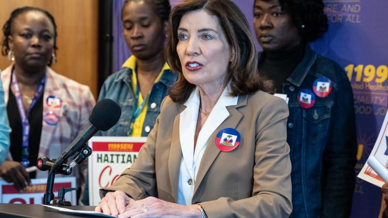 New York Gov. Kathy Hochul speaks at a rally alongside 1199SEIU members and immigration advocates following the SCOTUS ruling on allowing the Trump Administration to revoke protections for Haitians and Syrians.