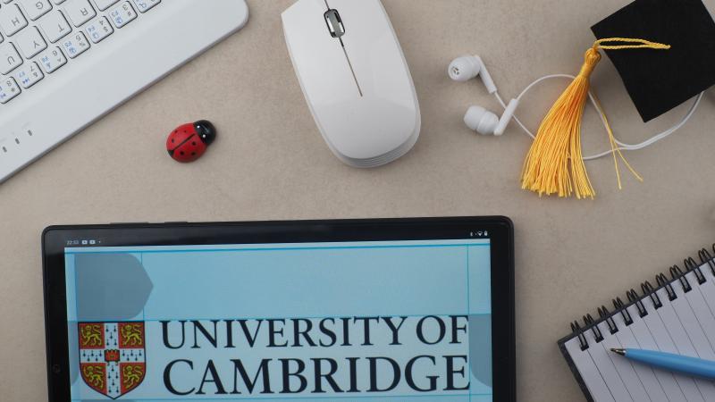 In this photo illustration, University of Cambridge logo seen displayed on a tablet. (Photo Illustration by Igor Golovniov/SOPA Images/LightRocket via Getty Images)