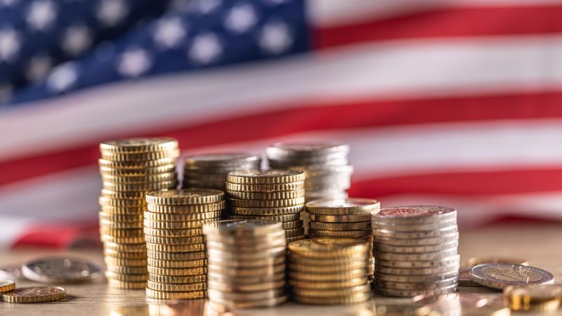 American flag and European Union coins for her as a global trade concept
