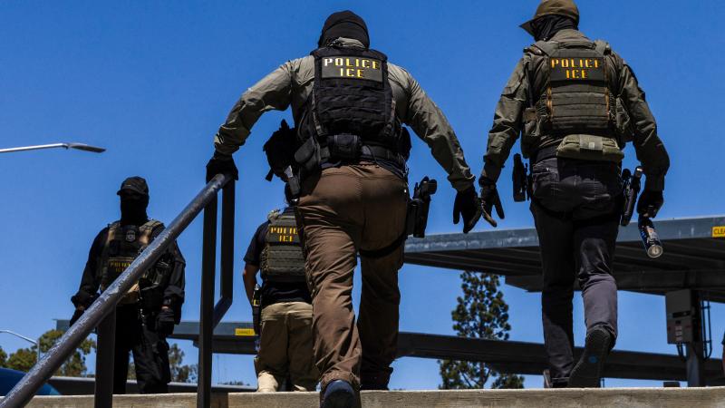 Immigration and Customs Enforcement (ICE) agents walk outside the Ventura County Government Center in Ventura, California, on July 27, 2026. 
