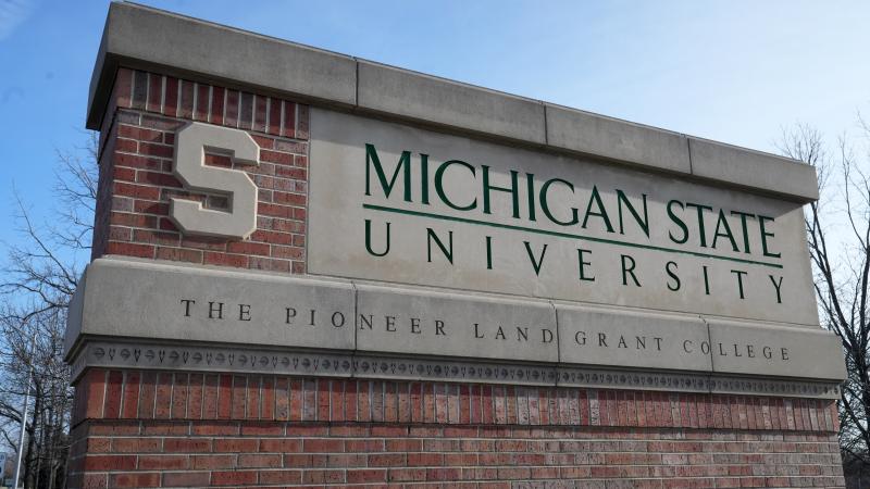 A sign at the entrance to Michigan State UniversityDecember 07, 2023 in East Lansing, Michigan. 