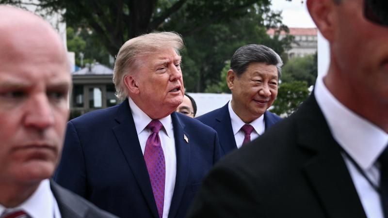 US President Donald Trump walks with China's President Xi Jinping after showing him Marine One and the new helipad on the South Lawn of the White House after their bilateral meeting, in Washington, DC, on September 24, 2026.