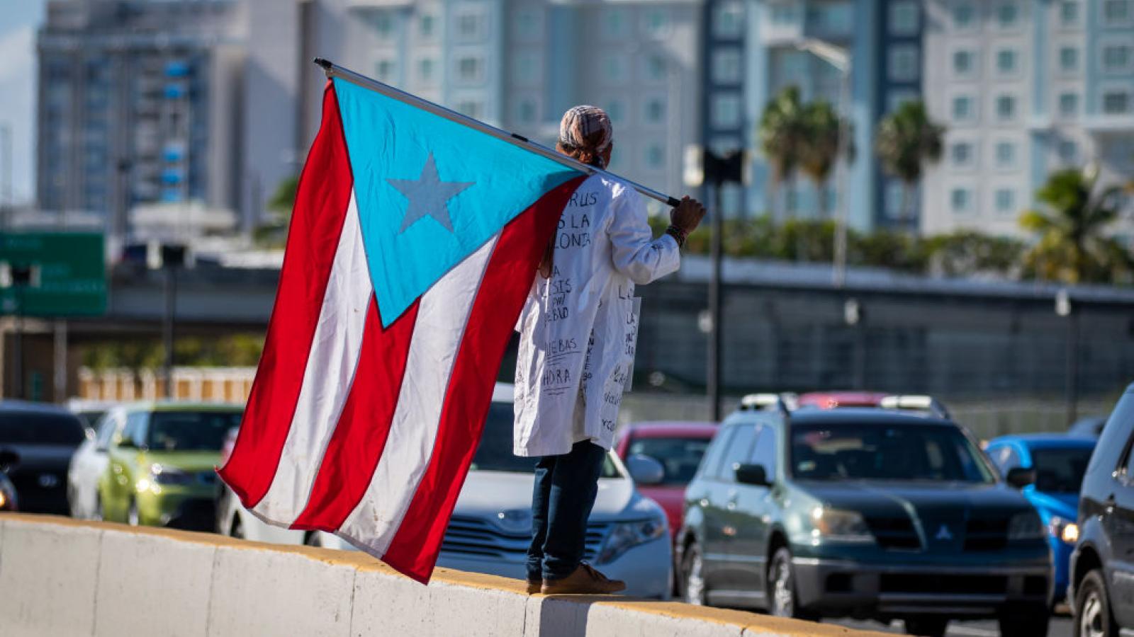 Protestors in Puerto Rico demand the airport be shut down amid a spike in coronavirus cases
