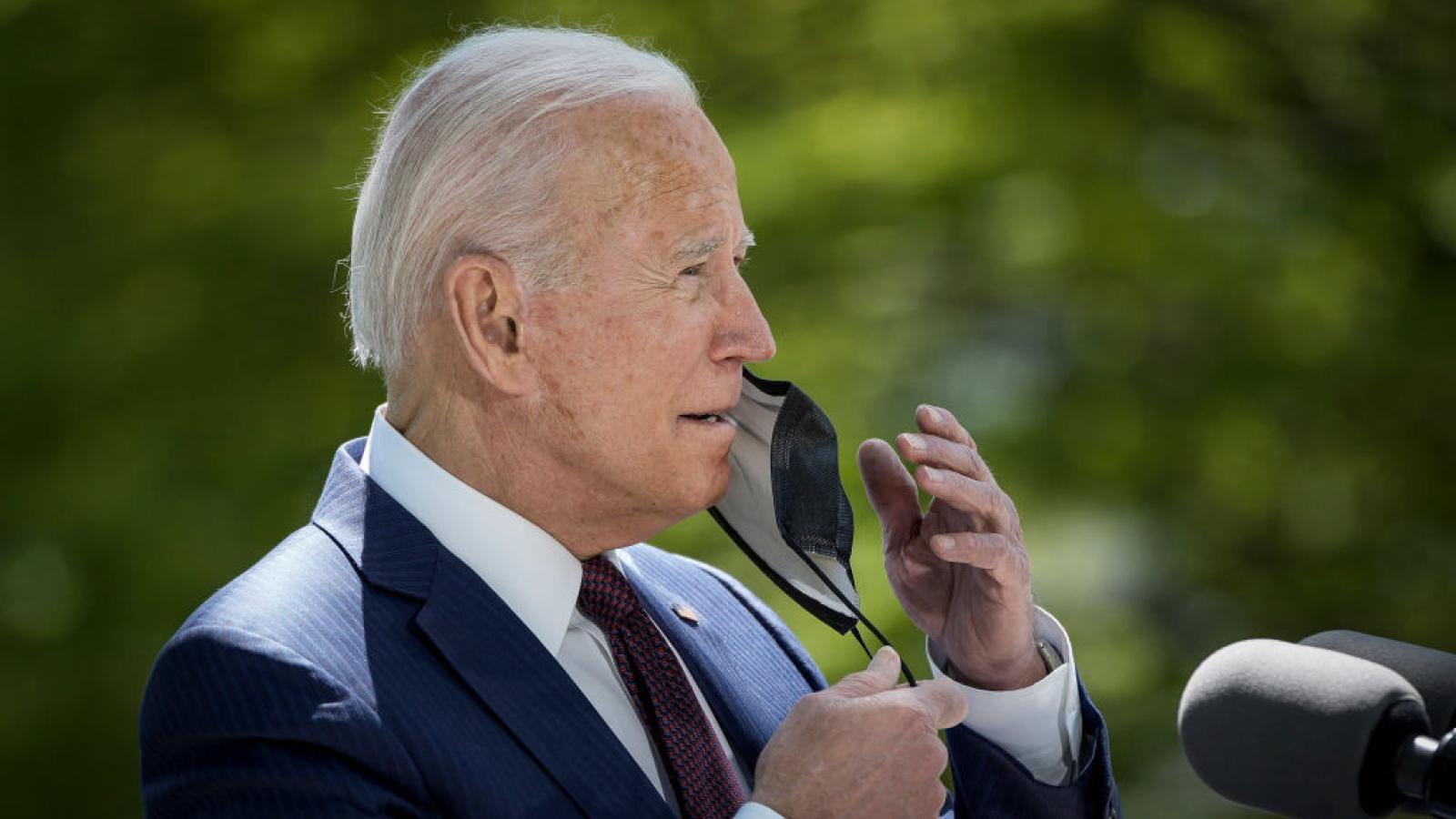 President Biden removes his face mask on April 27, 2021