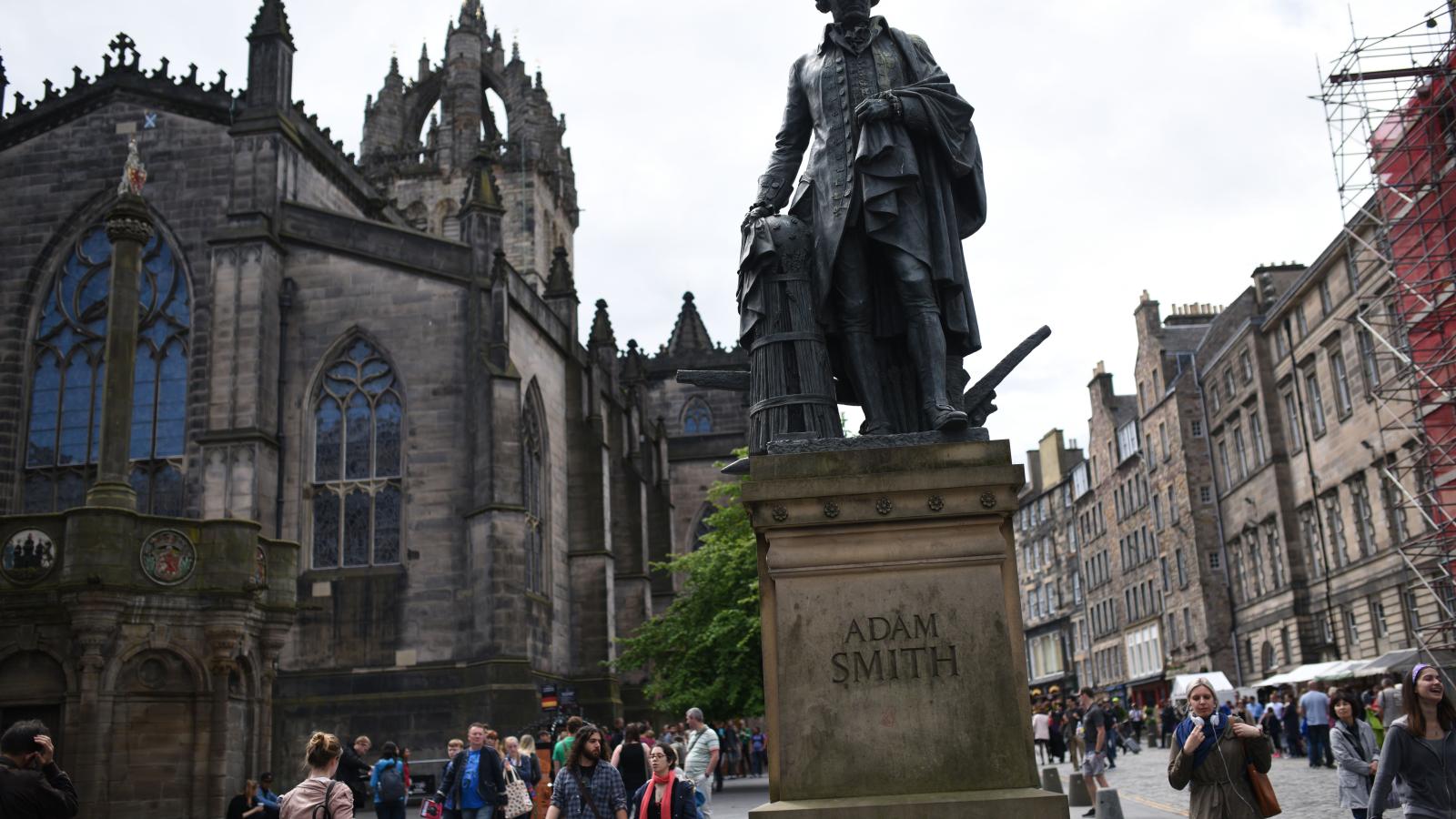 A statue of Scottish economist Adam Smith stands on the Royal Mile in Edinburgh, Scotland on June 25, 2016.