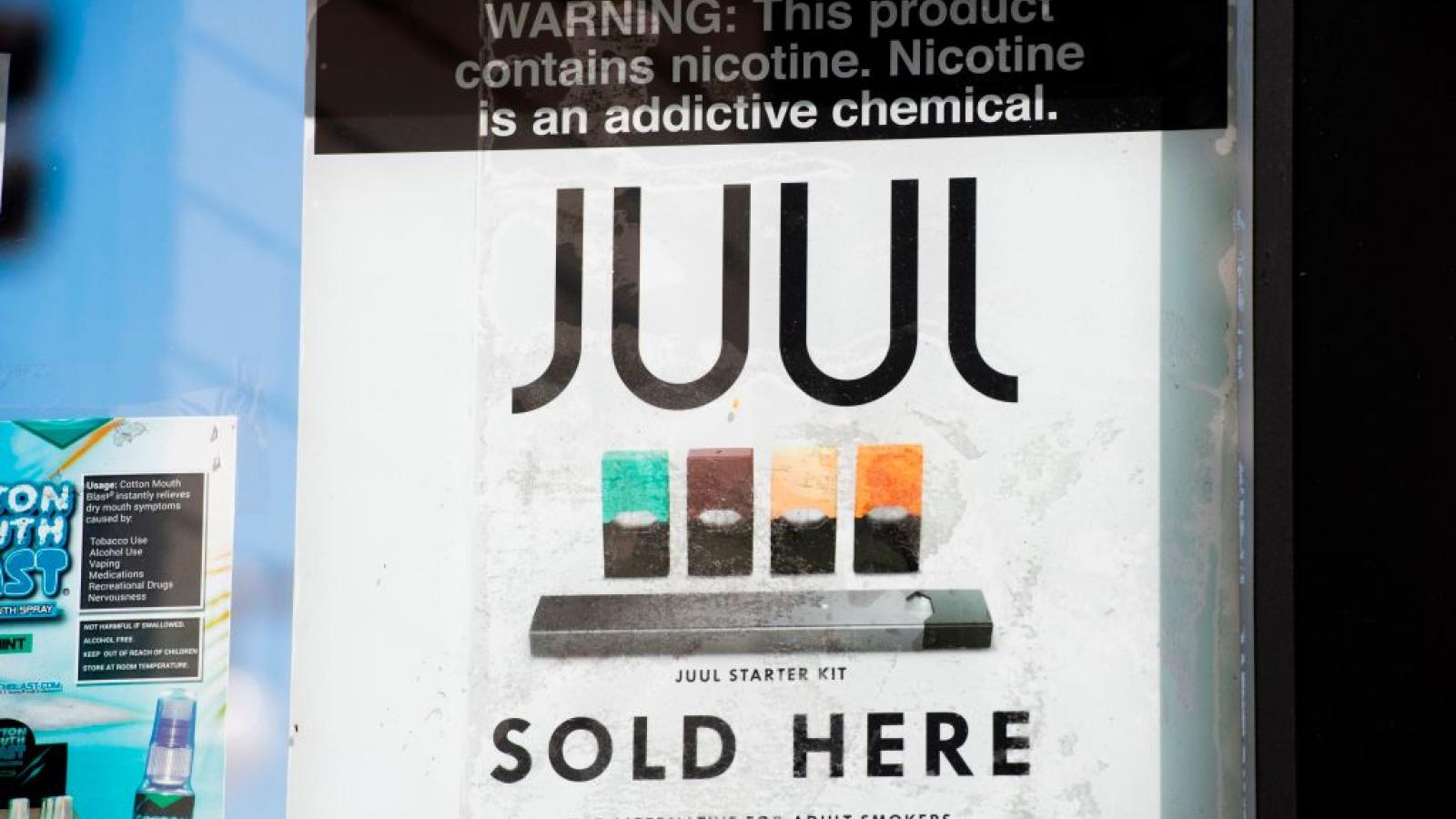 A sign advertises Juul vaping products
