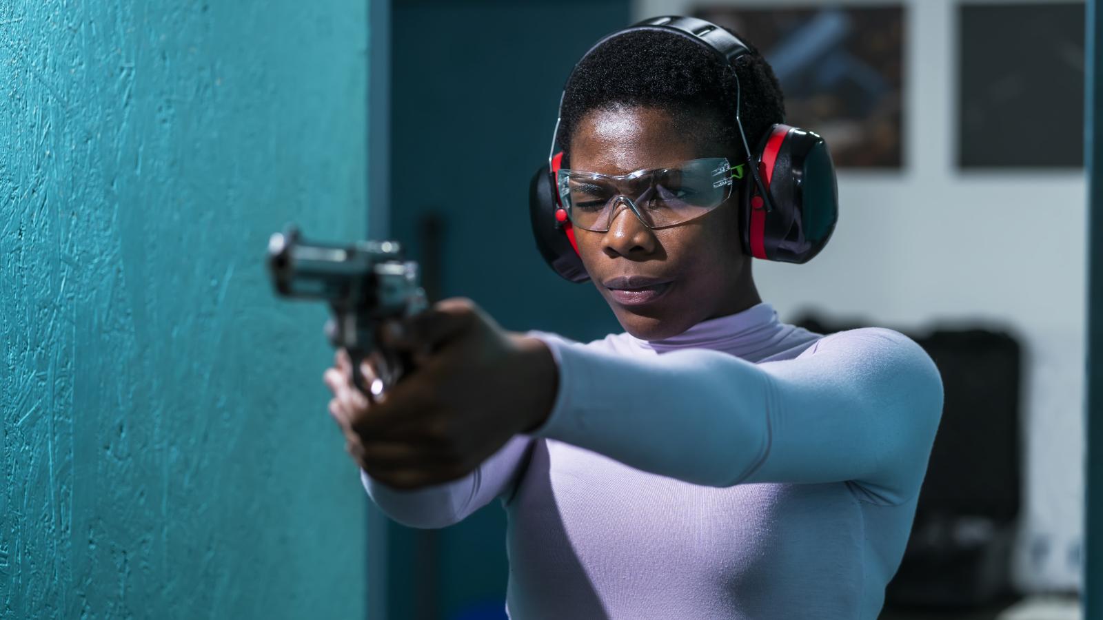 Black woman, shooting range, stock photo