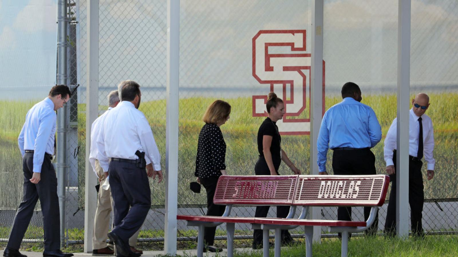 Members of the prosecution at the school, Aug. 4, 2022