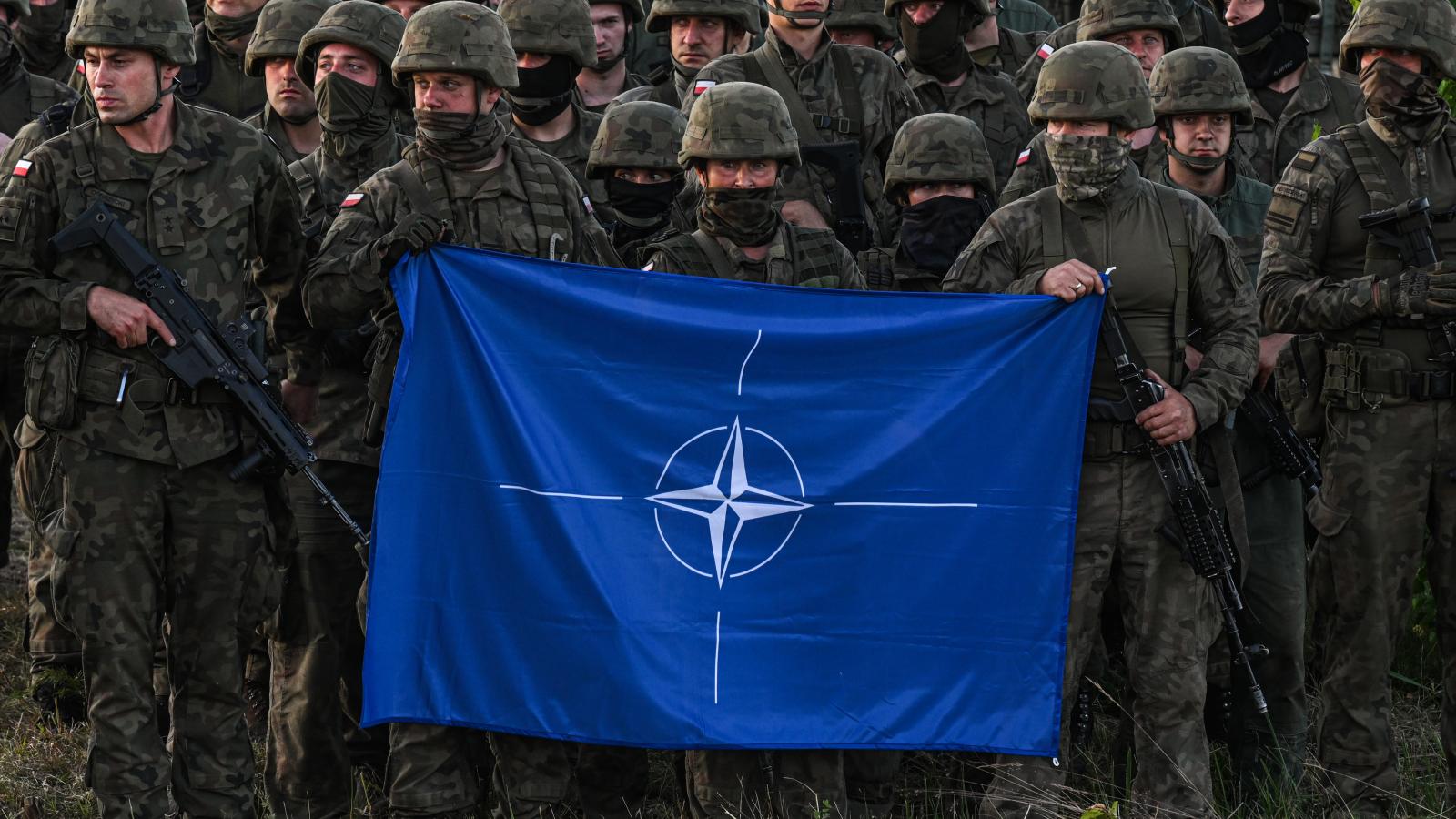 Polish soldiers, NATO flag, Orzysz, Poland, July 3, 2022