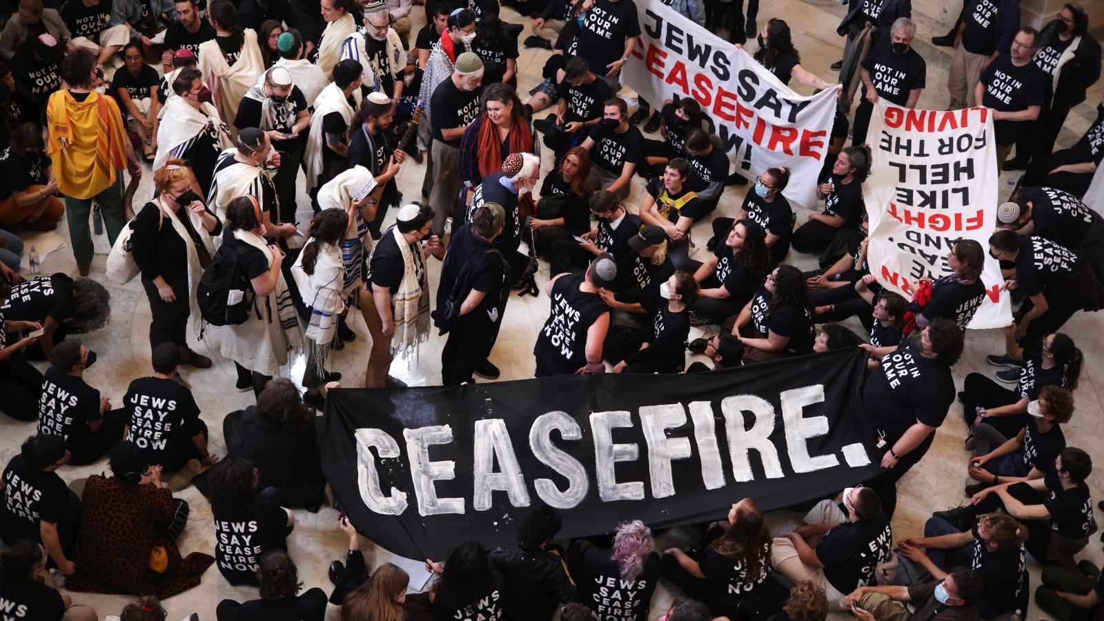 Protesters hold a demonstration in support of a cease fire against the Palestinians in Gaza in the Cannon House Office Building on October 18, 2023 in Washington, DC. Members of the Jewish Voice for Peace and the IfNotNow movement staged a rally to call for a cease fire in the Israel–Hamas war. (Photo by Alex Wong/Getty Images)