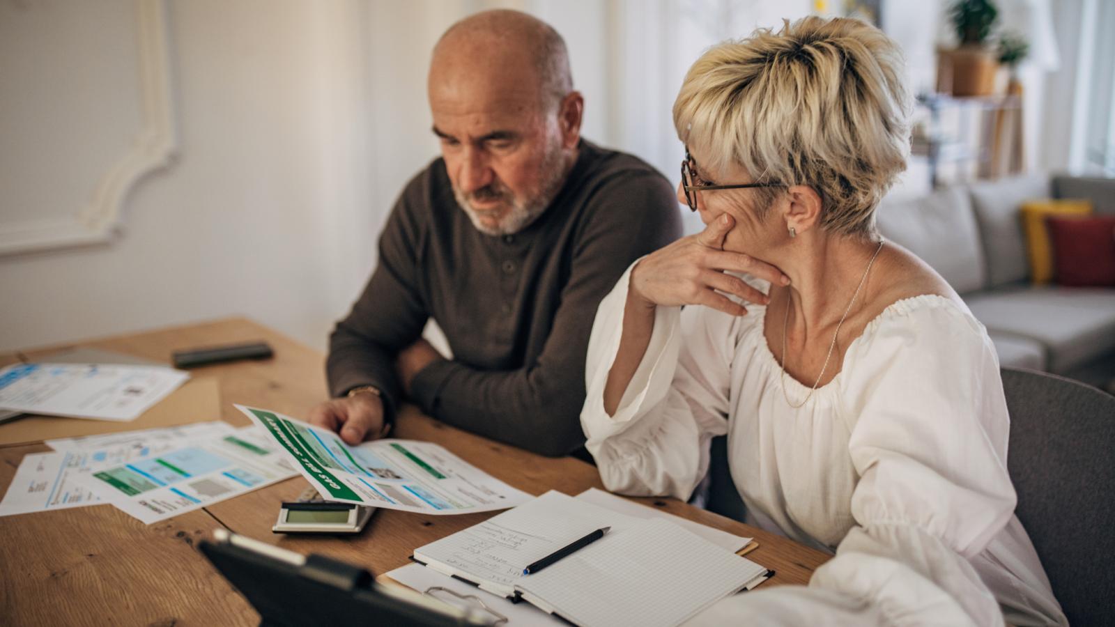 Couple calculating bills and taxes