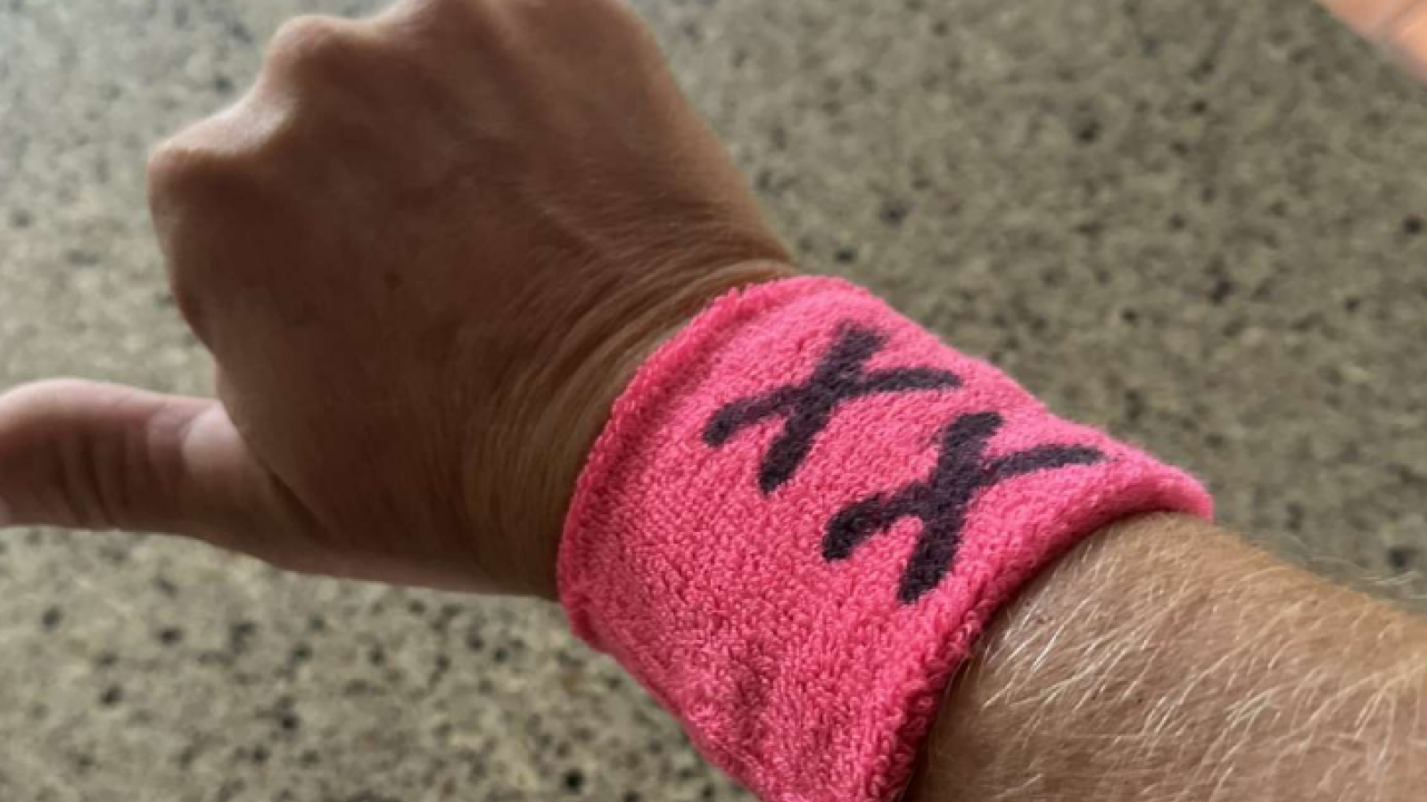 XX wristband worn by parents to protest transgender sports policy