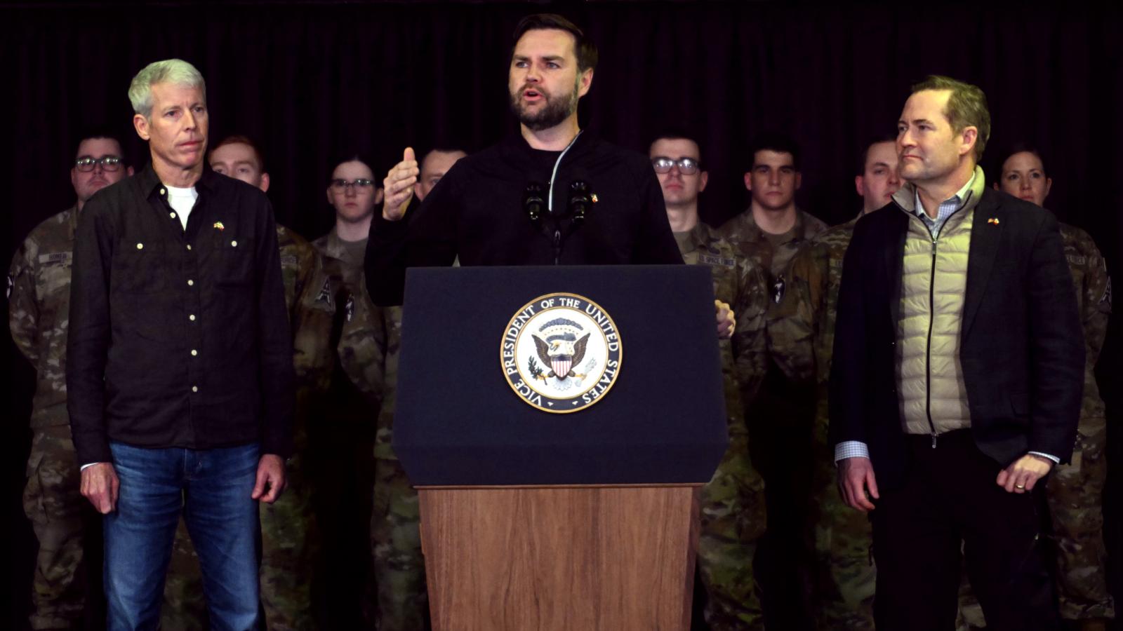 US Vice President JD Vance (C), with Secretary of Energy Chris Wright (L) and National Security Advisor Mike Waltz (R), speaks at the US military's Pituffik Space Base on March 28, 2025 in Pituffik, Greenland. 