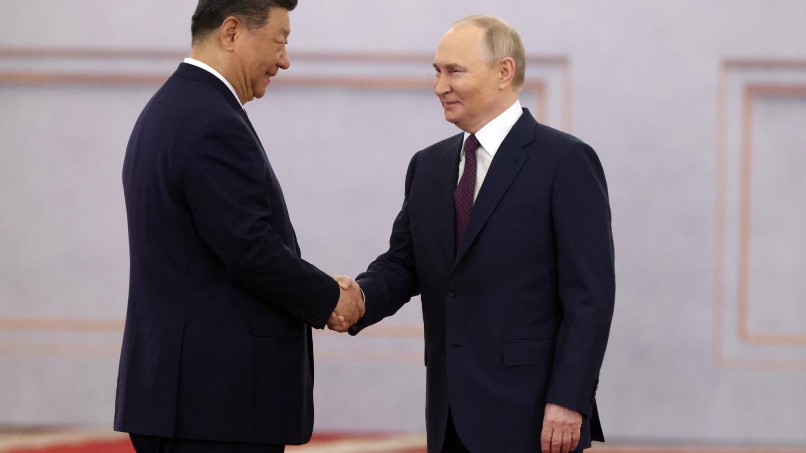 Russian President Vladimir Putin (R) shakes hands with Chinese President Xi Jinping (L) during their meeting at the Grand Kremlin Palace, May 8, 2025 in Moscow, Russia.