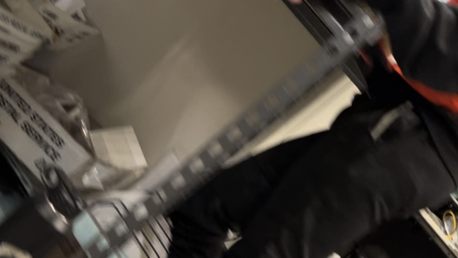 Runbeck workers man a ballot sorting machine.