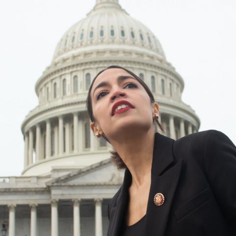 Representative Alexandra Ocasio-Cortez in front of the U.S. Capitol building
