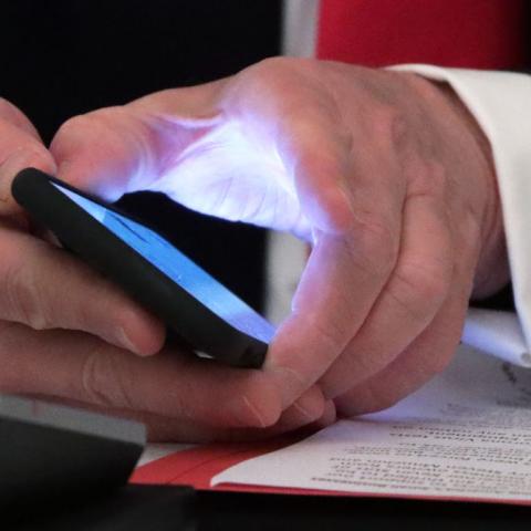 President Trump holding a phone on June 18, 2020