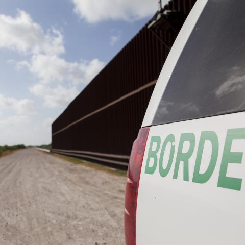 A Customs and Border Protection vehicle patrols the border wall in Rio Grande Valley sector of the Texas border.