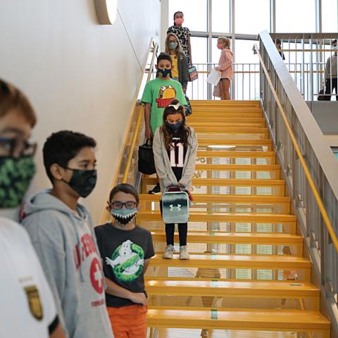 Massachusetts schoolchildren wait to go into lunch