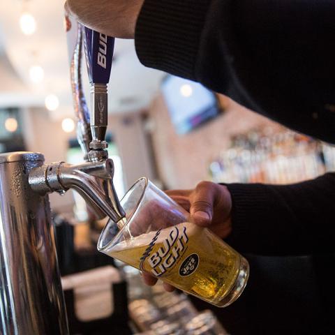 Beer poured from tap in 2015