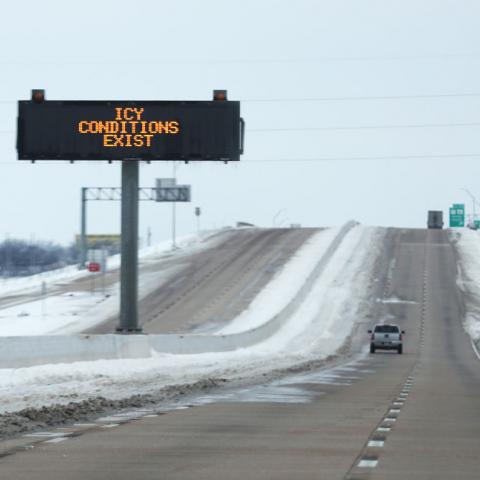 Sign warning about icy conditions in Texas on Feb. 18, 2021