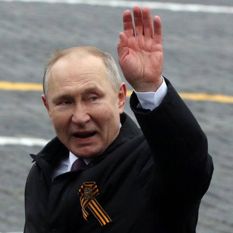 Russian President Vladimir Putin waves on May 9, 2021