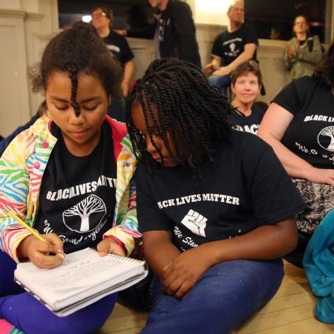 Teachers and students wear "Black Lives Matter" shirts in school