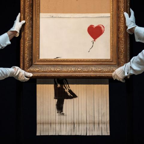 Shredded painting by Banksy re-sold at auction in London