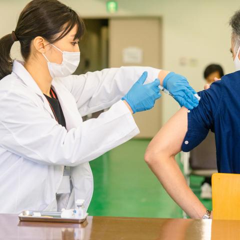 Elderly man getting vaccinated in Japan