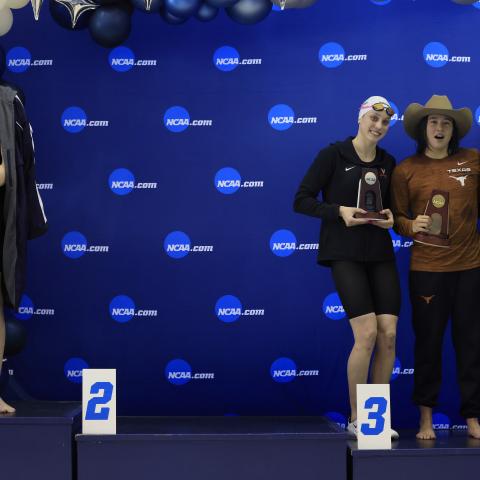 Transgender woman Lia Thomas (L) of the University of Pennsylvania stands on the podium after winning the 500-yard freestyle as other medalists (L-R) Emma Weyant, Erica Sullivan and Brooke Forde pose for a photo at the NCAA Division I Women's Swimming & Diving Championship on March 17, 2022 in Atlanta, Georgia.