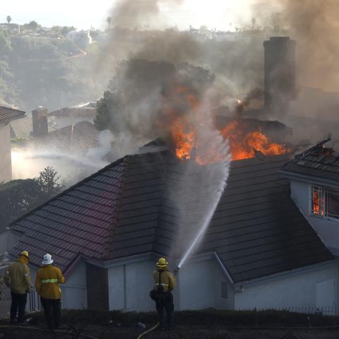 Fast moving wildfire burns homes in California's Orange County